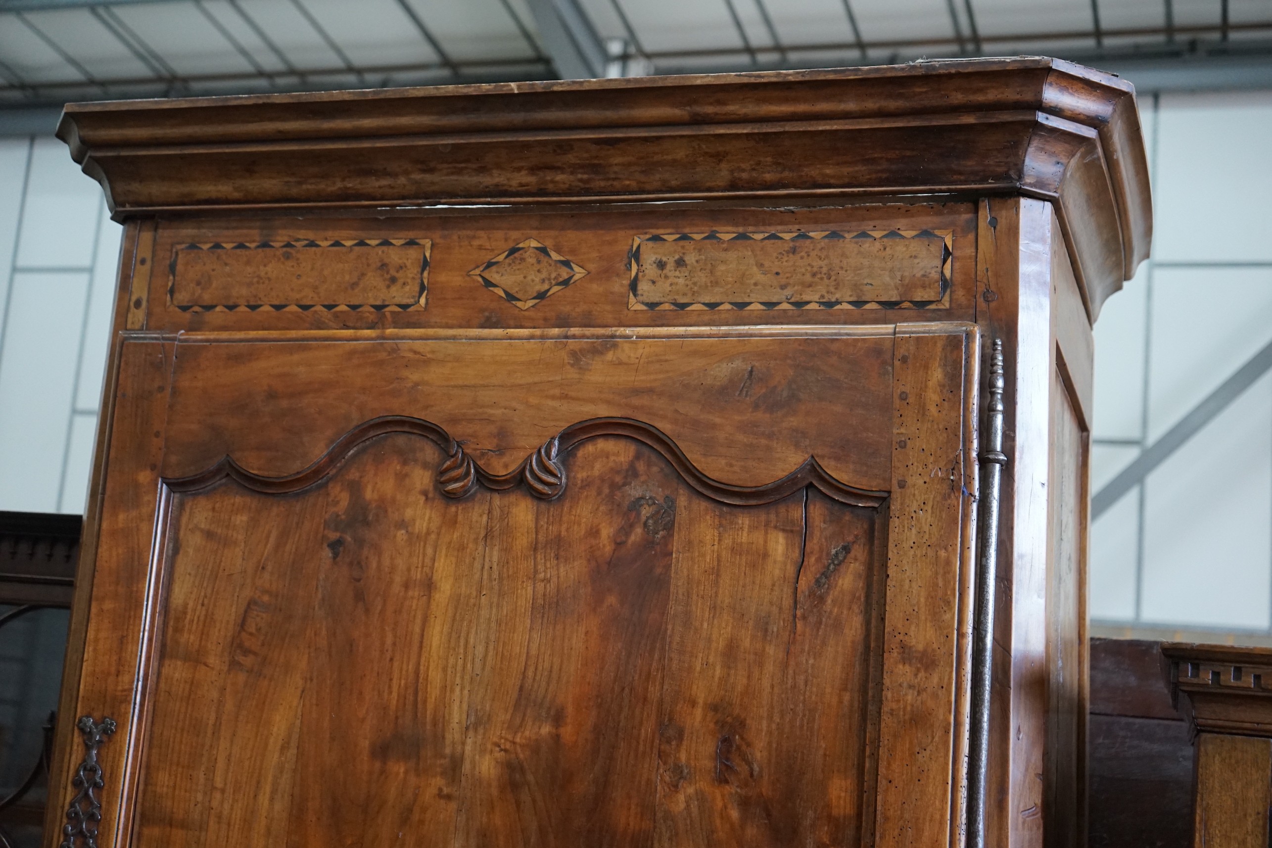 An early 19th century French parquetry inlaid walnut armoire, length 116cm, depth 69cm, height 227cm